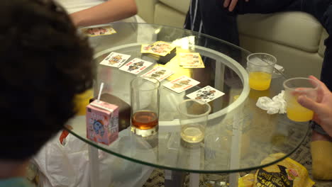 Group-of-unidentifiable-asian-young-people-playing-cards