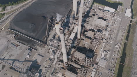 Slow-aerial-flyover-during-the-day-of-the-smoke-stacks-at-a-power-plant