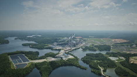 Wide-aerial-hyperlapse-during-the-day-of-a-power-plant-on-Hyco-Lake,-North-Carolina