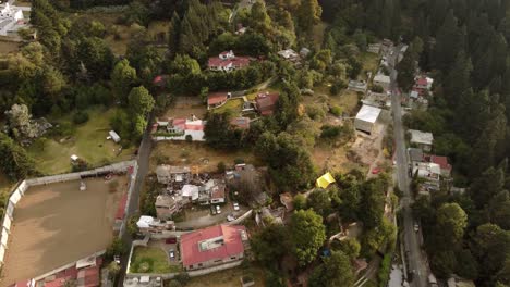 Aerial-Shot-Of-Residential-Area-Middle-Of-Forest-Valley,-Mexico