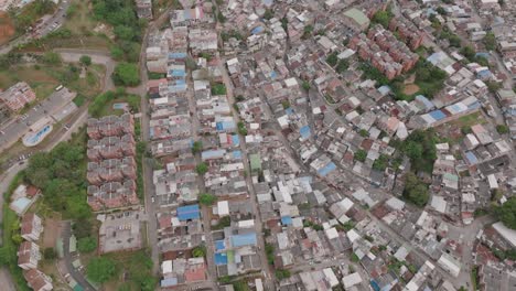 Wide-aerial-footage-of-a-sprawling-neighborhood-in-Cali,-Colombia