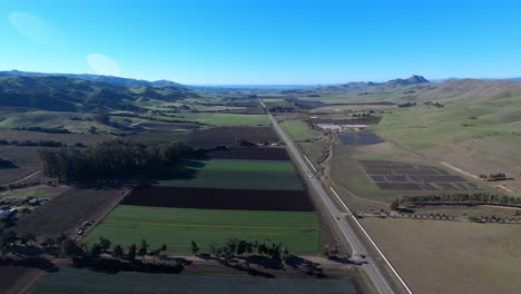 A-forward-aerial-view-flying-over-the-Los-Osos-Valley-Road-in-San-Luis-Obispo-headed-towards-Baywood-Los-Osos-and-the-Morro-Bay