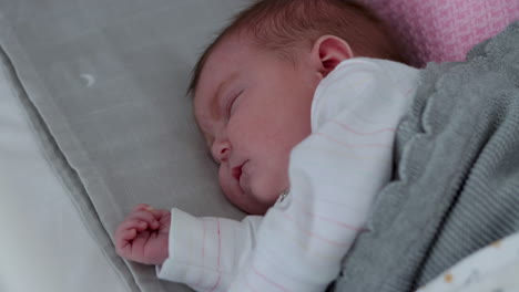 Cute-baby-girl-sleeping-peacefully-on-her-side