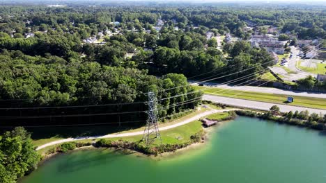 Aerial-View-Of-Electricity-Pylon-Beside-Oak-Grove-Lake-In-Chesapeake