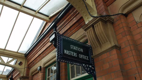 Close-up-of-a-station-master's-office-sign-at-an-old-British-railway-train-station