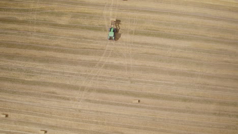 Harvesting-Ripe-Grain-In-A-Large-Field---aerial-top-down