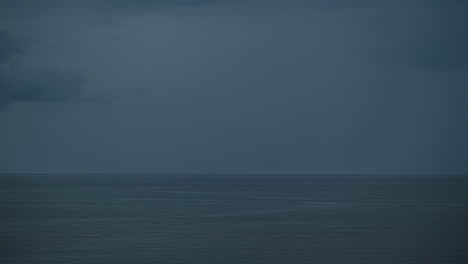Gloomy-Dark-Sky-Over-Calm-Deep-Ocean