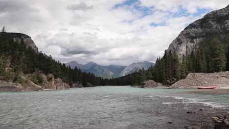 View-of-the-river-water-flowing-from-bow-falls-into-bow-river-in-Banff,-Canada