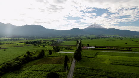 Drone-shot-with-a-view-of-the-road-that-leads-to-the-top-of-the-popocate-volcano-during-morning