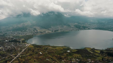 San-Pablo-Lake-And-Imbabura-Volcano-On-A-Cloudy-Day-In-Ecuador---drone-shot