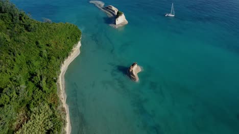 Aerial-of-corfu-island-in-Greece-with-stunning-lonely-unpolluted-beach-mediterranean-paradise-for-summer-holiday