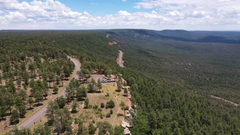4K-Drone-flying-over-the-edge-of-a-rocky-cliff-on-the-Mogollon-rim-in-Payson-Arizona-on-a-sunny-day-with-clouds-in-the-sky
