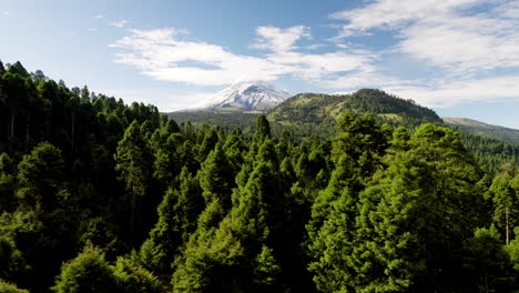 Drone-shot-overlooking-the-surrounding-forest-of-the-popocatepetl-volcano-national-park