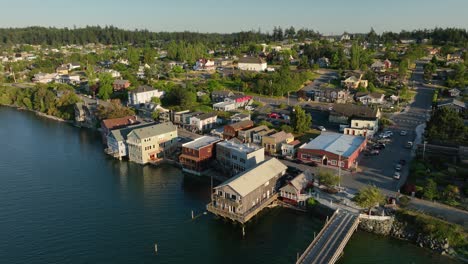 Drone-shot-pulling-away-from-Coupeville's-main-street-amenities-to-show-the-entirety-of-the-city-and-the-wharf
