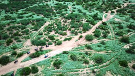 Travelers-During-Safari-Motorcycle-Tour-In-Kenya---aerial-drone-shot