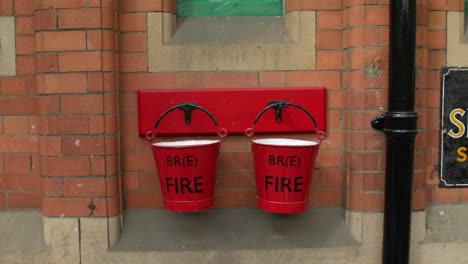 Old-red-fire-buckets-at-a-vintage-railway-station