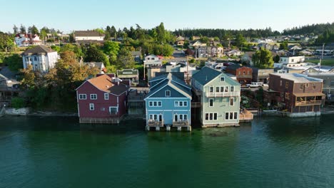 Panning-aerial-shot-of-Coupeville's-historic-business-district-with-multiple-buildings-hanging-out-over-the-water