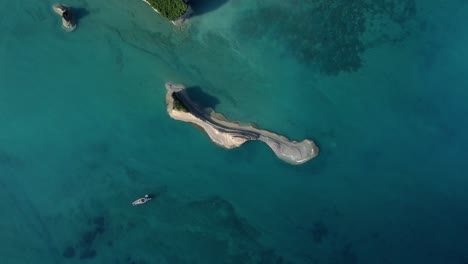 Aerial-top-down-of-rocky-islet-in-corfu-island-Greece-summer-paradise