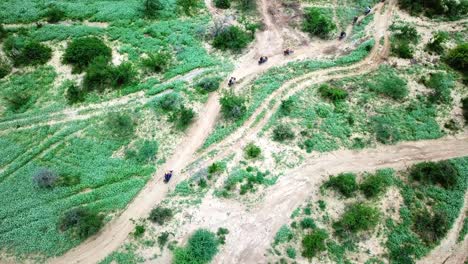 Motorcycles-Passing-Through-Winding-Paths-In-Ngorongoro-Conservation-Park,-Tanzania,-East-Africa