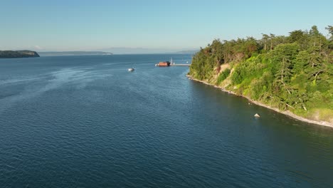 Aerial-shot-flying-alongside-the-Coupeville-shoreline-out-towards-the-community's-famous-wharf