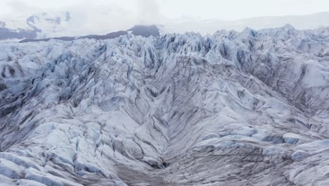 Frozen-ice-glacier-landscape-in-Iceland,-close-up-aerial