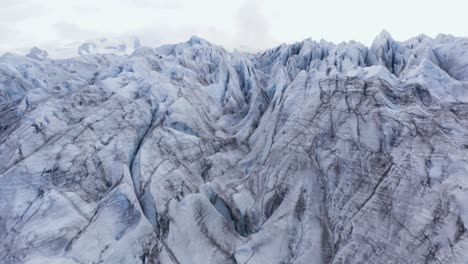 Jagged-ice-surface-of-large-arctic-glacier,-aerial