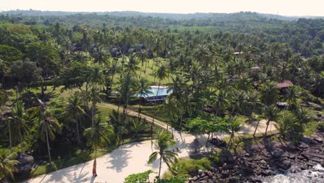 A-beautiful-rotational-drone-shot-of-the-tropical-island-of-Koh-Kood,-overlooking-Koh-Kood-Beach-Resort-in-Thailand-in-Southeast-Asia