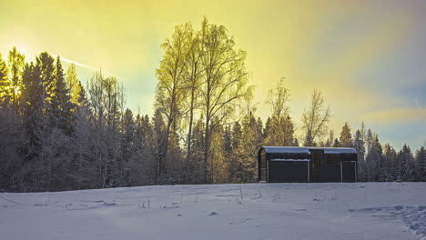 A-glorious-golden-sunrise-in-the-winter-countryside-at-a-camping-trailer---time-lapse