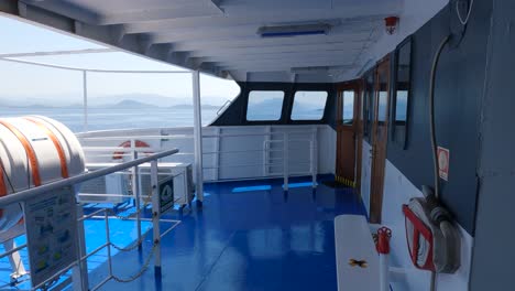 View-of-Ferry-boat-empty-deck-with-safety-equipment,-Panning-left-shot