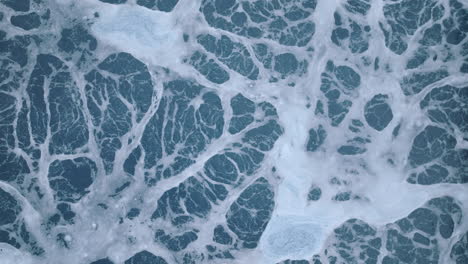 Close-static-aerial-footage-of-a-chemical-pool-that-slowly-rises