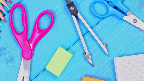 School-Supplies-on-a-Blue-Table-Background
