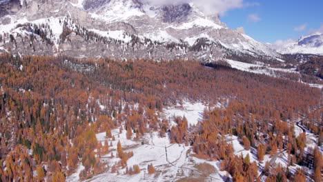 Season-change-from-autumn-to-winter-with-light-snow-on-Dolomites-mountains