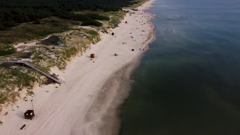 Aerial-establishing-shot-of-super-long-white-sand-beach