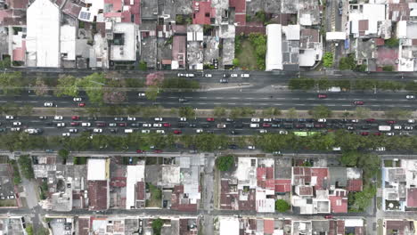 Wide-top-down-aerial-of-busy-city-streets-and-traffic-in-Guatemala-City,-Guatemala