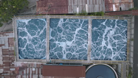 Wide-static-aerial-top-down-footage-of-chemical-pools