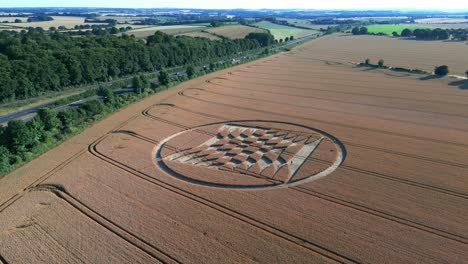 Crop-Circles-With-Tractor-Tracks-On-Agricultural-Field-At-Summer