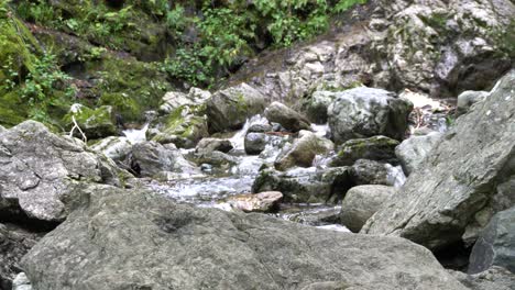 A-charming-stream-of-water-is-enclosed-by-splendid-rocks-in-a-mountain