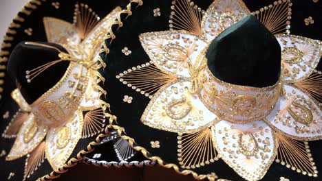 Close-up-of-a-couple-traditional-Mexican-sombrero-with-golden-color-designs