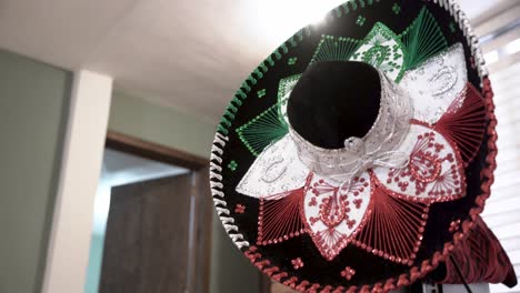 Close-up-of-a-traditional-Mexican-sombrero-with-its-traditional-colors,-green,-white-and-red