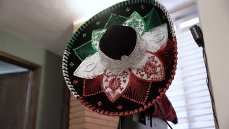 Traditional-Mexican-sombrero-with-its-traditional-colors,-green,-white-and-red,-hanging