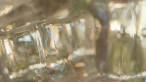 Macro-dolly-shot-on-a-glass-of-water-with-ice