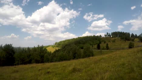 A-timelapse-of-the-clouds-passing-by-in-the-sky-and-cows-wandering-around