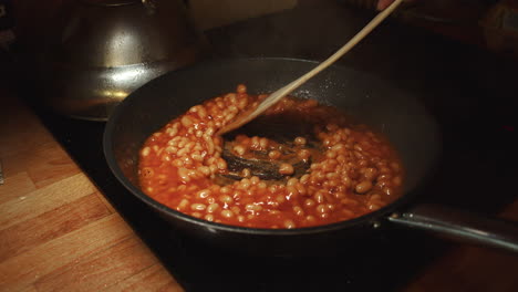 Fry-the-beans-in-tomato-sauce-in-a-hot-pan