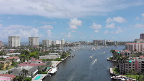 Rising-drone-shot-over-waterway-canal-for-boats-and-yachts-in-Fort-Lauderdale-Miami-Florida-beach-life