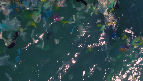 Aerial-top-down,-plastic-trash-pollution-floating-on-ocean-surface