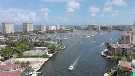 Forward-moving-drone-shot-over-waterway-canal-for-boats-and-yachts-in-Fort-Lauderdale-Miami-Florida-beach-life