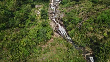 Aerial-shot-overhead-follows-the-journey-of-flowing-water-down-the-Thac-Bac-known-as-silver-falls-in-a-Vietnam-South-East-Asia