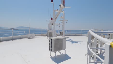 Tilt-up-shot-Antennas-and-radar-equipment-on-top-of-the-bridge-of-a-ferry-boat,-Transportation-Technology