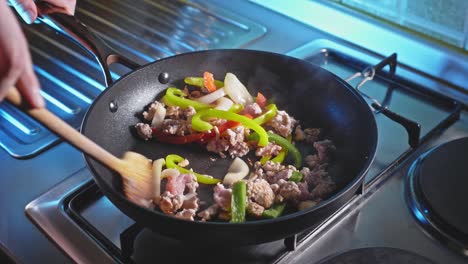 Cooking-And-Stirring-Ground-Turkey-With-Bell-Pepper-And-Onion