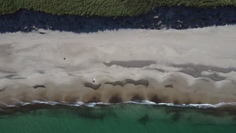 Beautiful-white-beach-filmed-from-above-with-a-drone,-in-bulbjerg-in-denmark